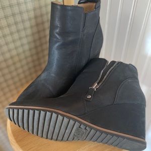 Lightly worn wedge boots.